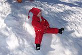 our little niece trying very hard to do snow angels